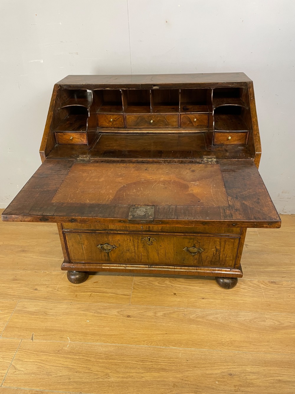 Early eighteenth century walnut bureau on original bun feet  View V