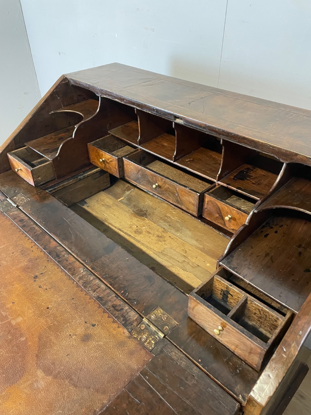 Early eighteenth century walnut bureau on original bun feet  View X