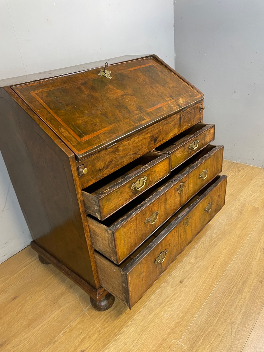 Early eighteenth century walnut bureau on original bun feet  View XI
