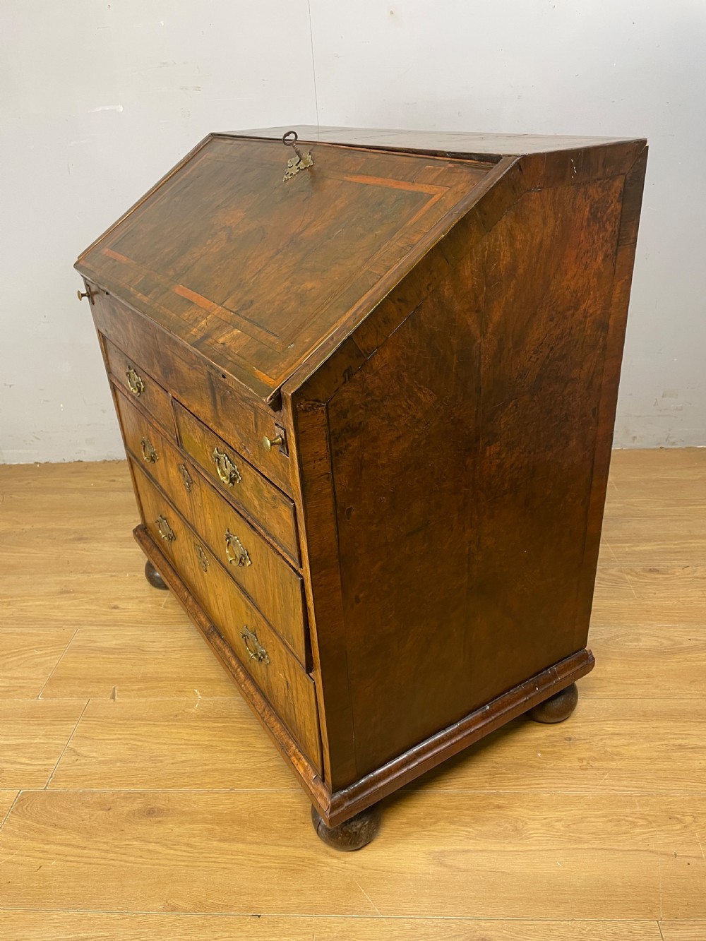 Early eighteenth century walnut bureau on original bun feet  View XIII