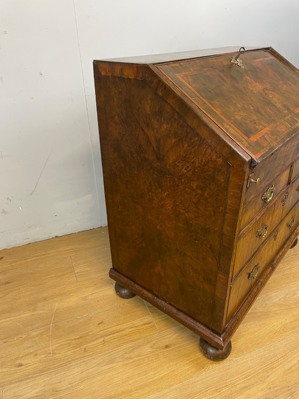 Early eighteenth century walnut bureau on original bun feet  View XIV