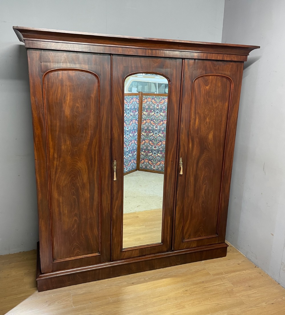 C19TH flame mahogany country house three door triple wardrobe 