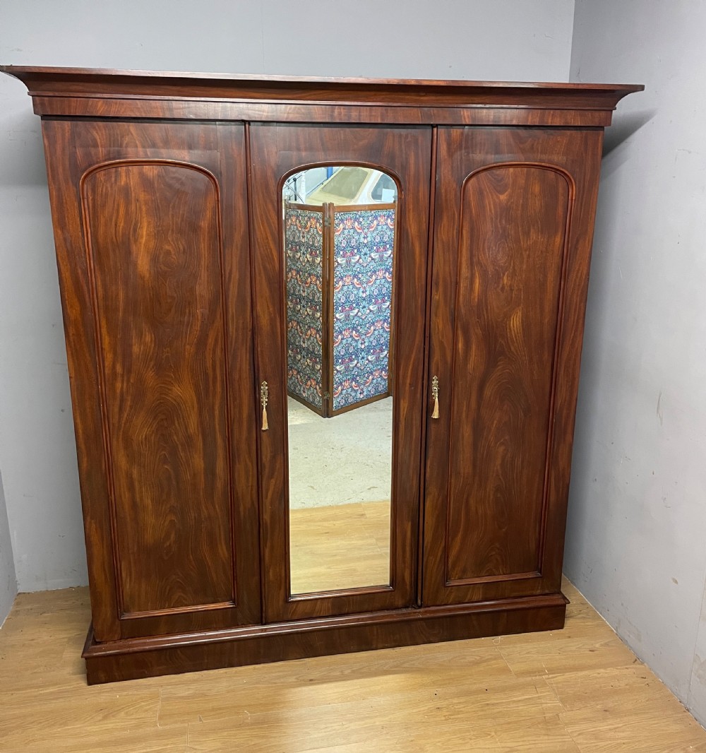 C19TH flame mahogany country house three door triple wardrobe  View III