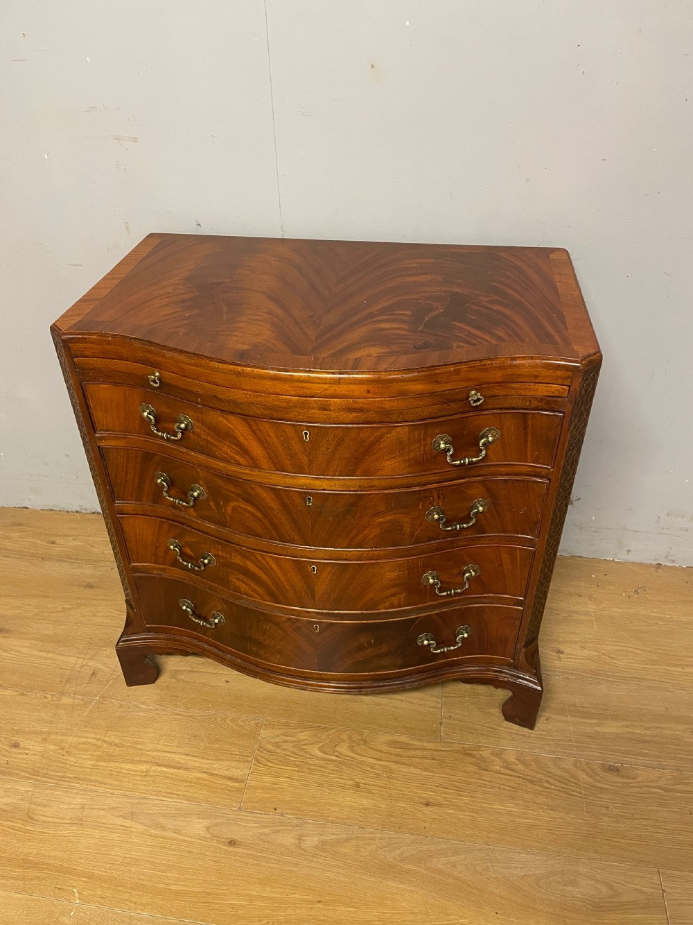 Edwardian small flame mahogany serpentine chest of drawers  View II