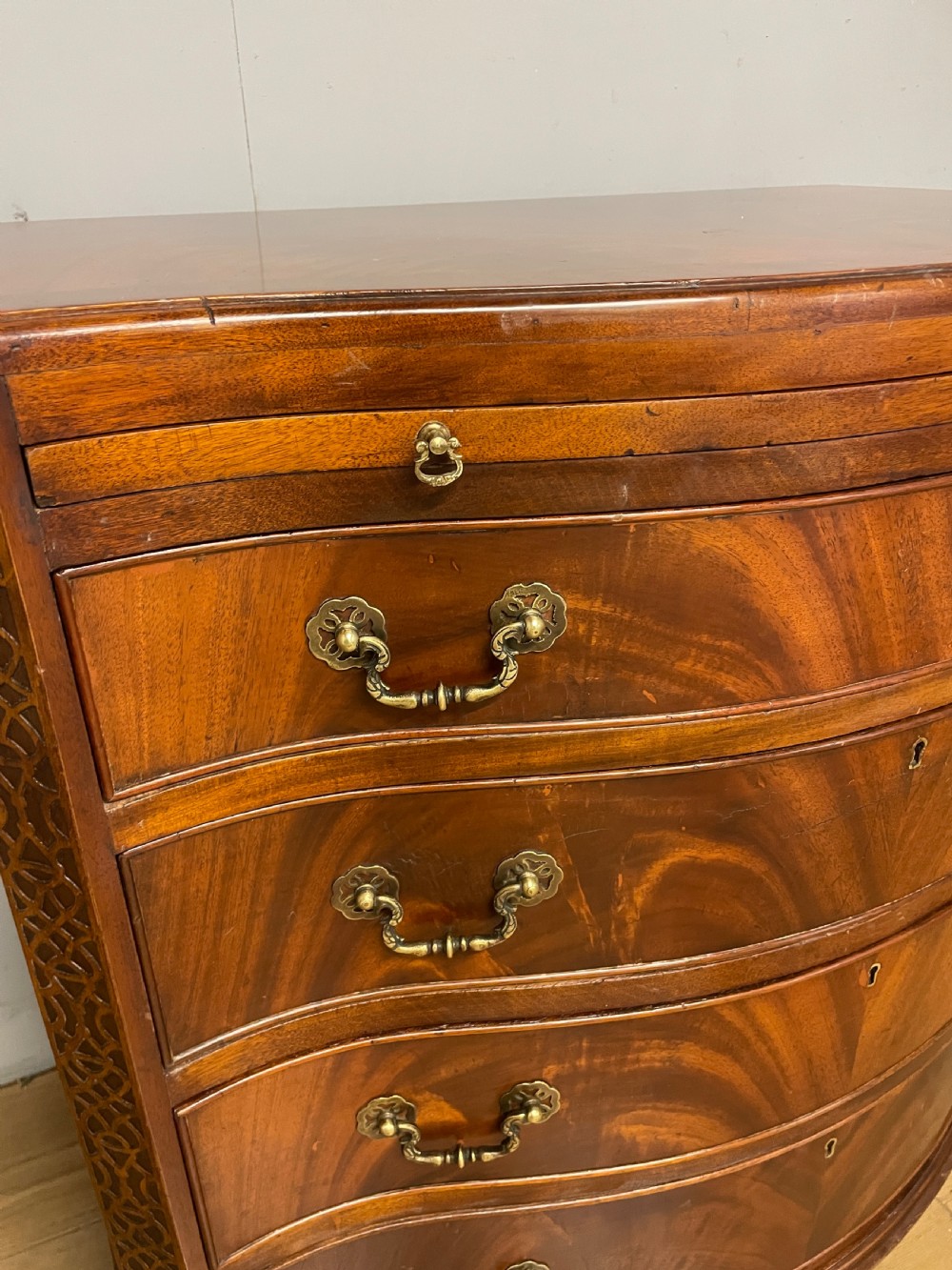 Edwardian small flame mahogany serpentine chest of drawers  View V
