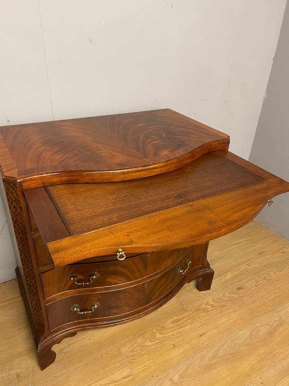 Edwardian small flame mahogany serpentine chest of drawers  View VI