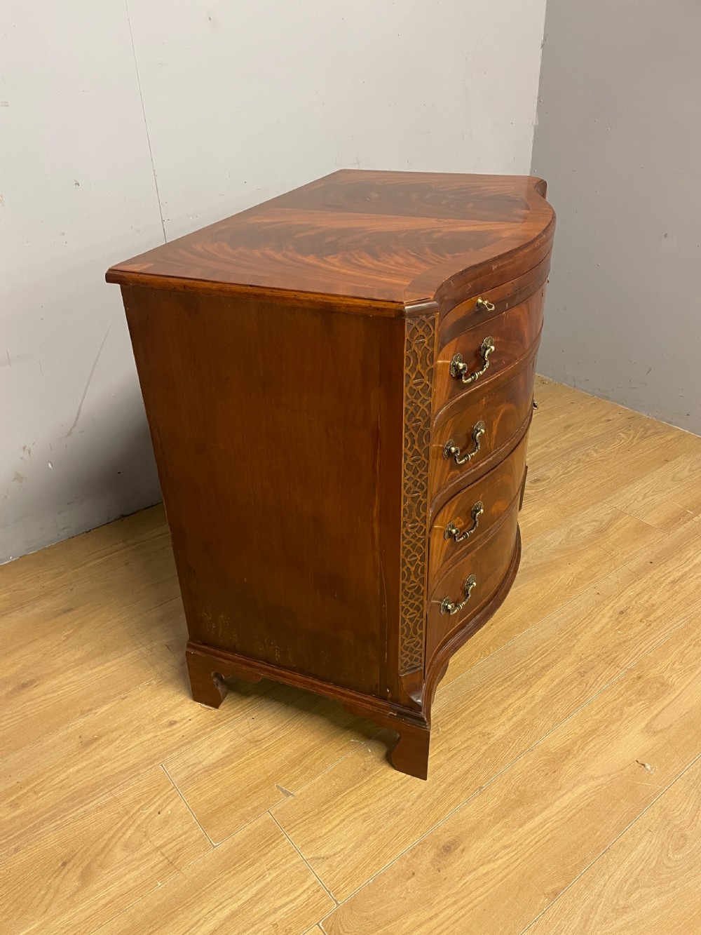 Edwardian small flame mahogany serpentine chest of drawers  View IX