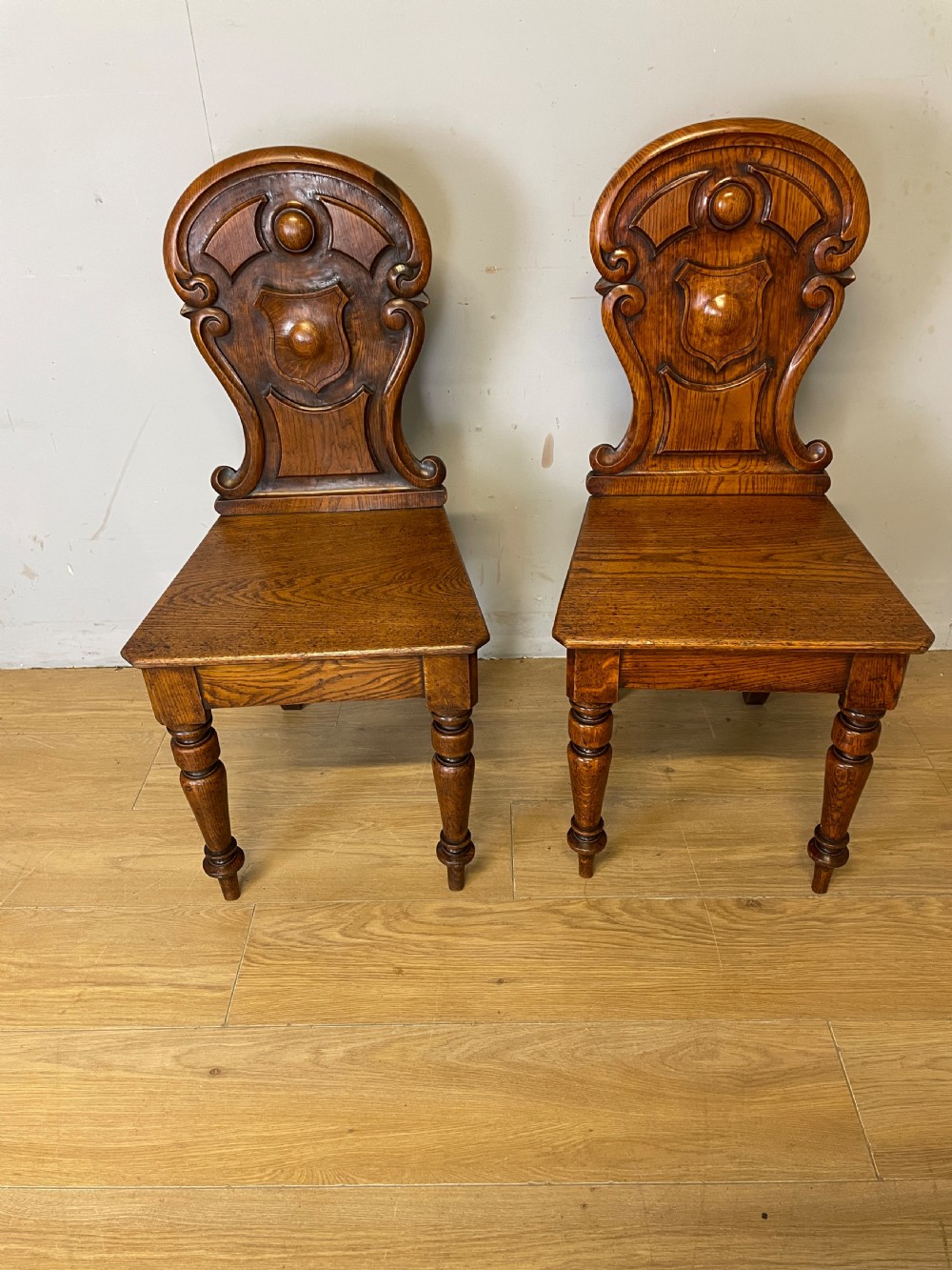 Pair of carved oak nineteenth century hall chairs  View II