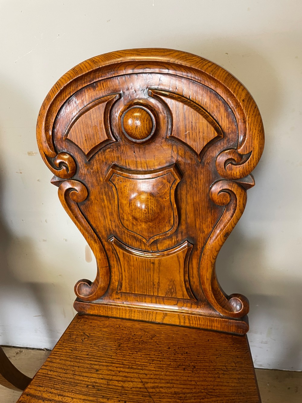 Pair of carved oak nineteenth century hall chairs  View V