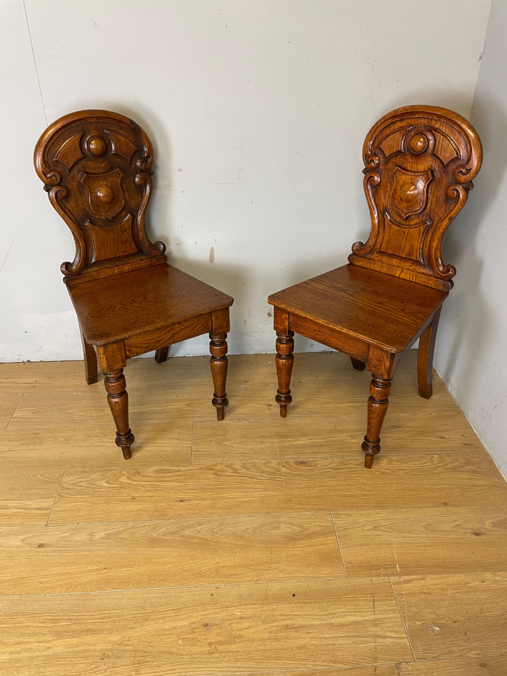 Pair of carved oak nineteenth century hall chairs  View XI