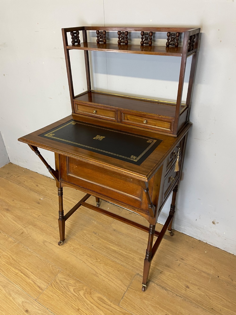 Liberty and Co Aesthetic Movement walnut writing desk in the manner of Christopher Dresser 