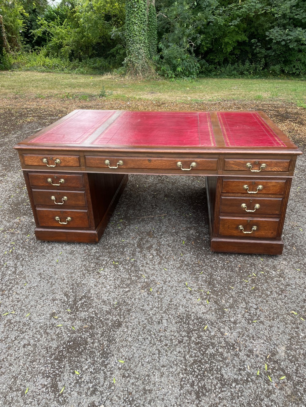 Late C19TH London made oak partners desk with inset red leather top 
