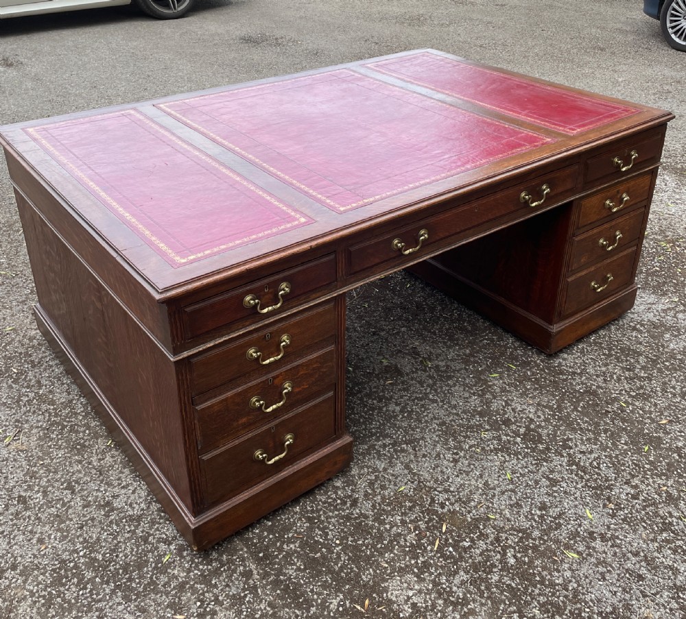 Late C19TH London made oak partners desk with inset red leather top  View IV