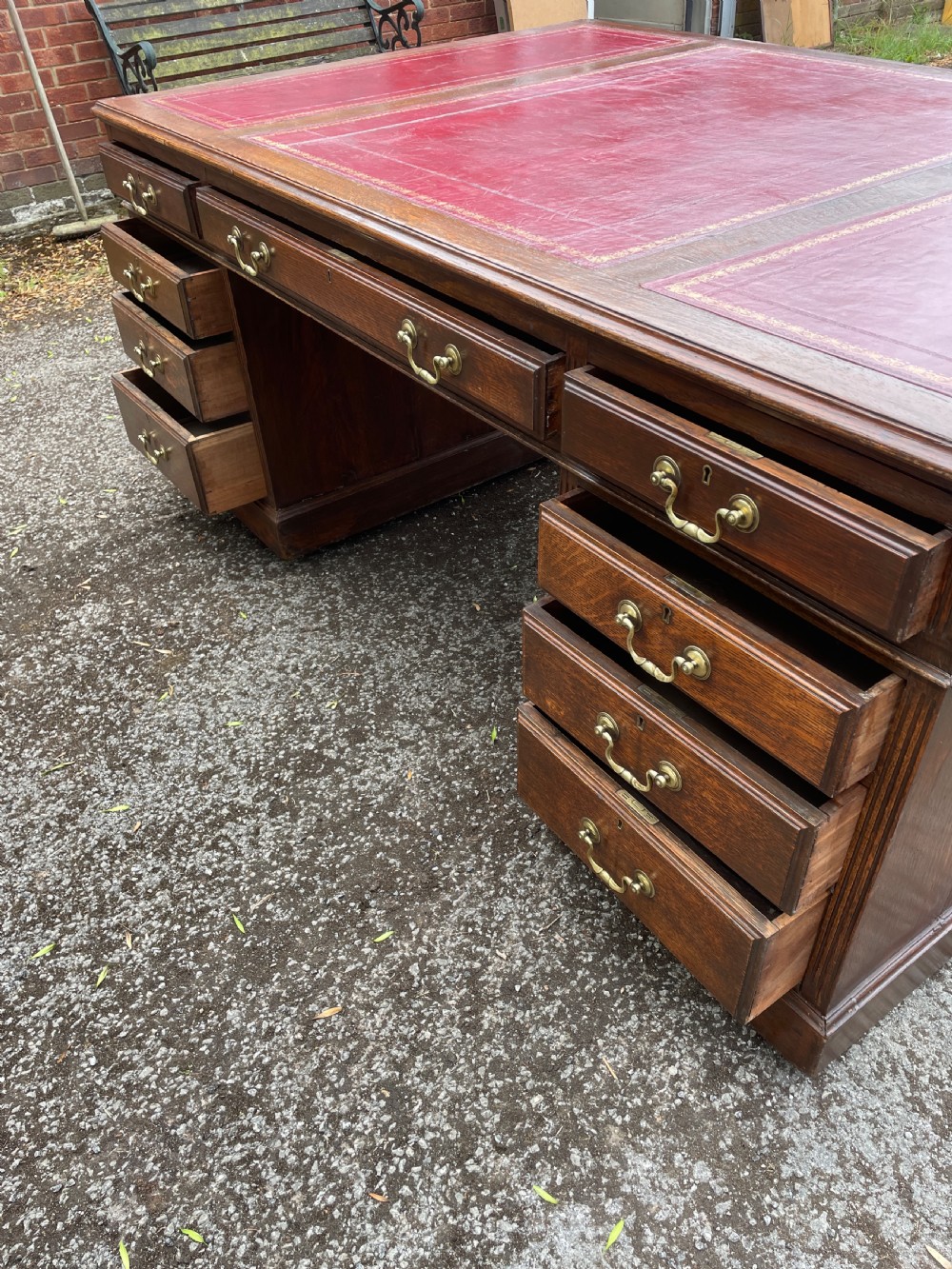 Late C19TH London made oak partners desk with inset red leather top  View IX