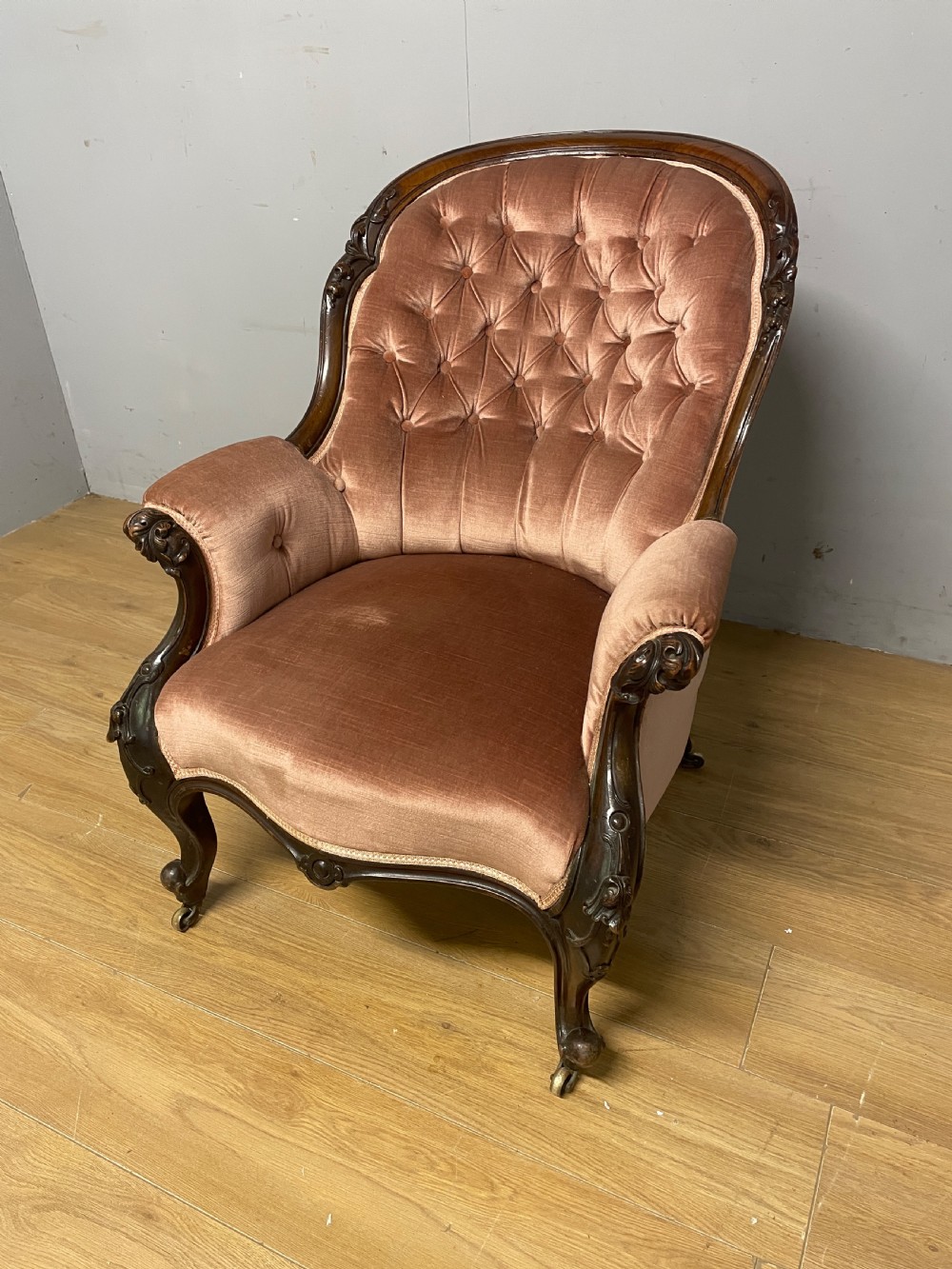 C19TH deep buttoned carved mahogany armchair  