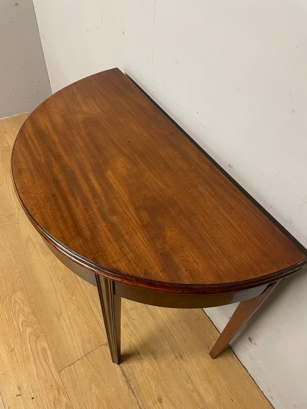 George III solid mahogany demi lune tea table circa 1790 View V