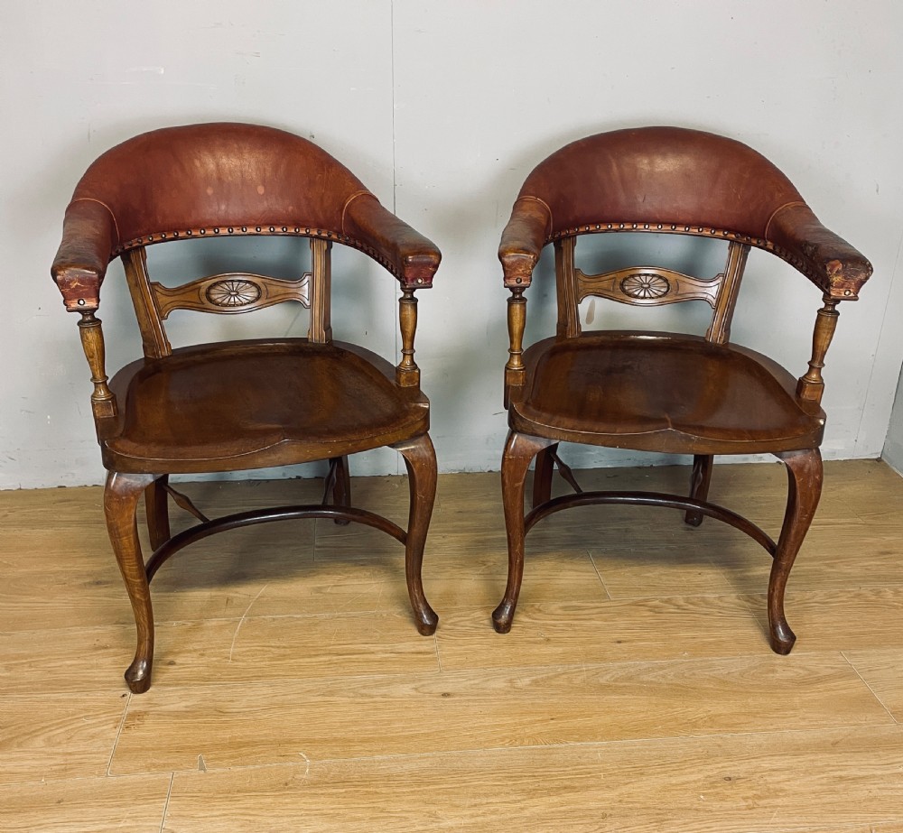 Pair of Victorian mahogany and leather library desk chairs 