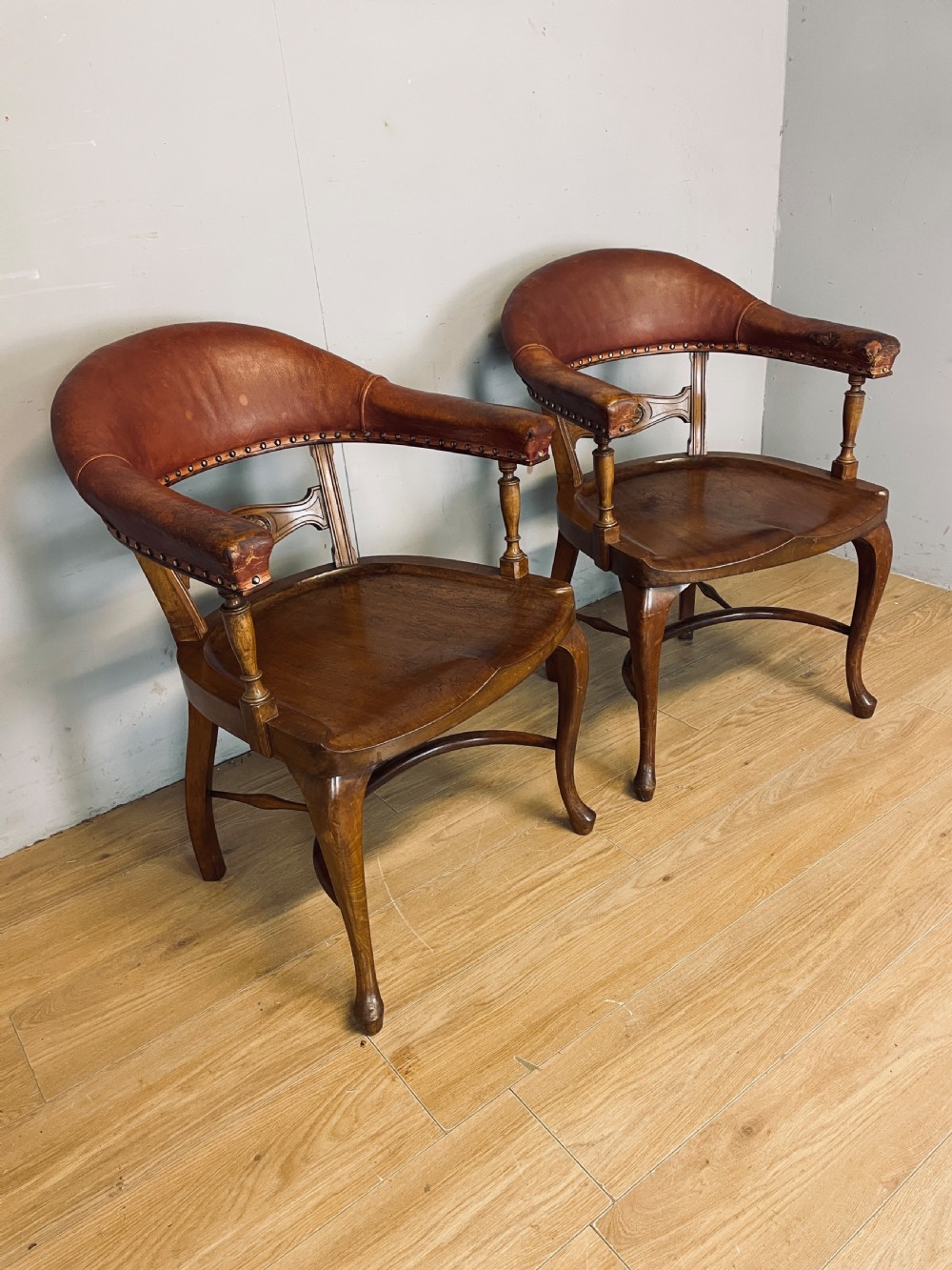 Pair of Victorian mahogany and leather library desk chairs  View II
