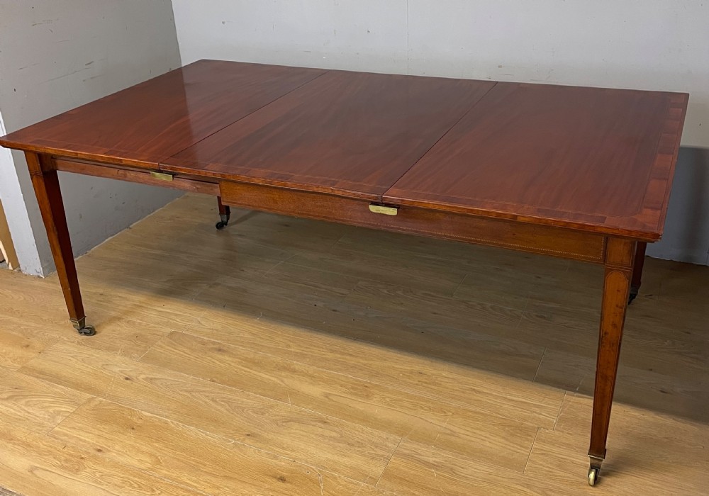 C19TH inlaid mahogany extending dining table by Gillows circa 1895  View II