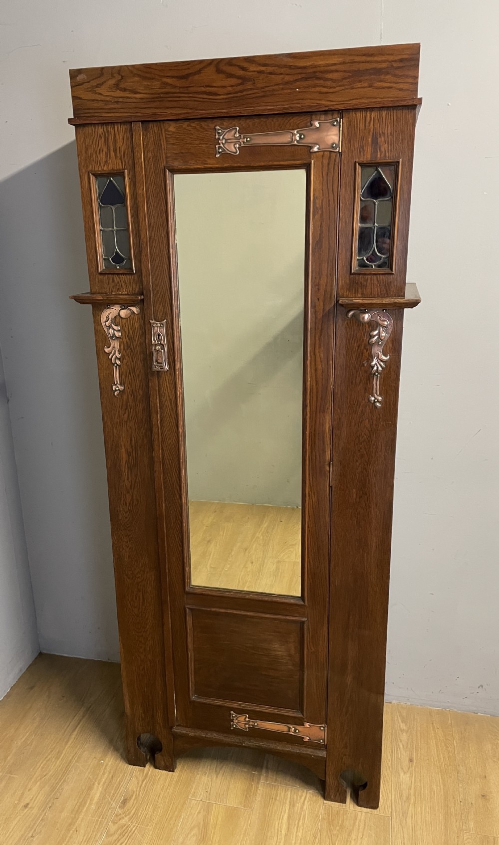 London made Arts and Crafts oak hall robe in the style of Liberty 