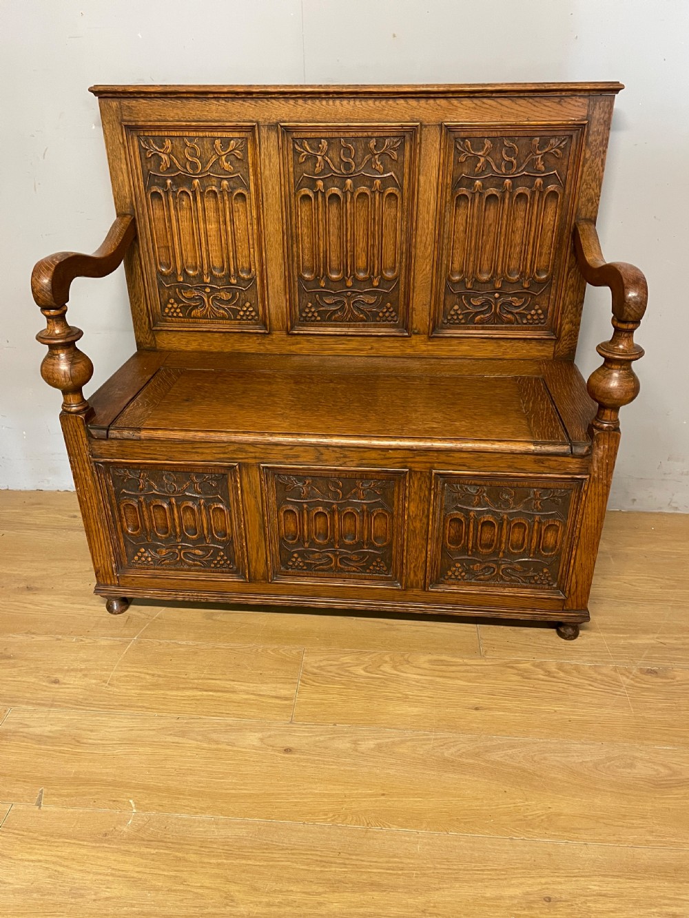 Arts and Crafts golden oak carved box settle  View II