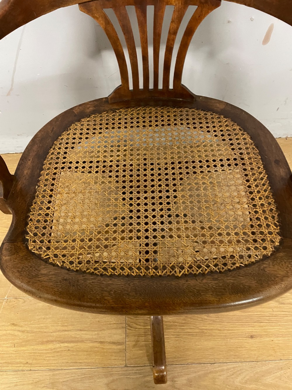 Edwardian swivel tilting office chair with a cane seat  View V
