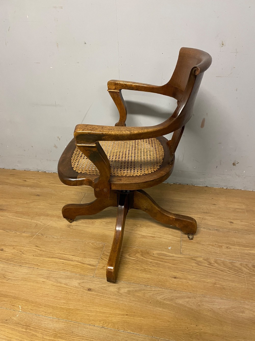 Edwardian swivel tilting office chair with a cane seat  View VII