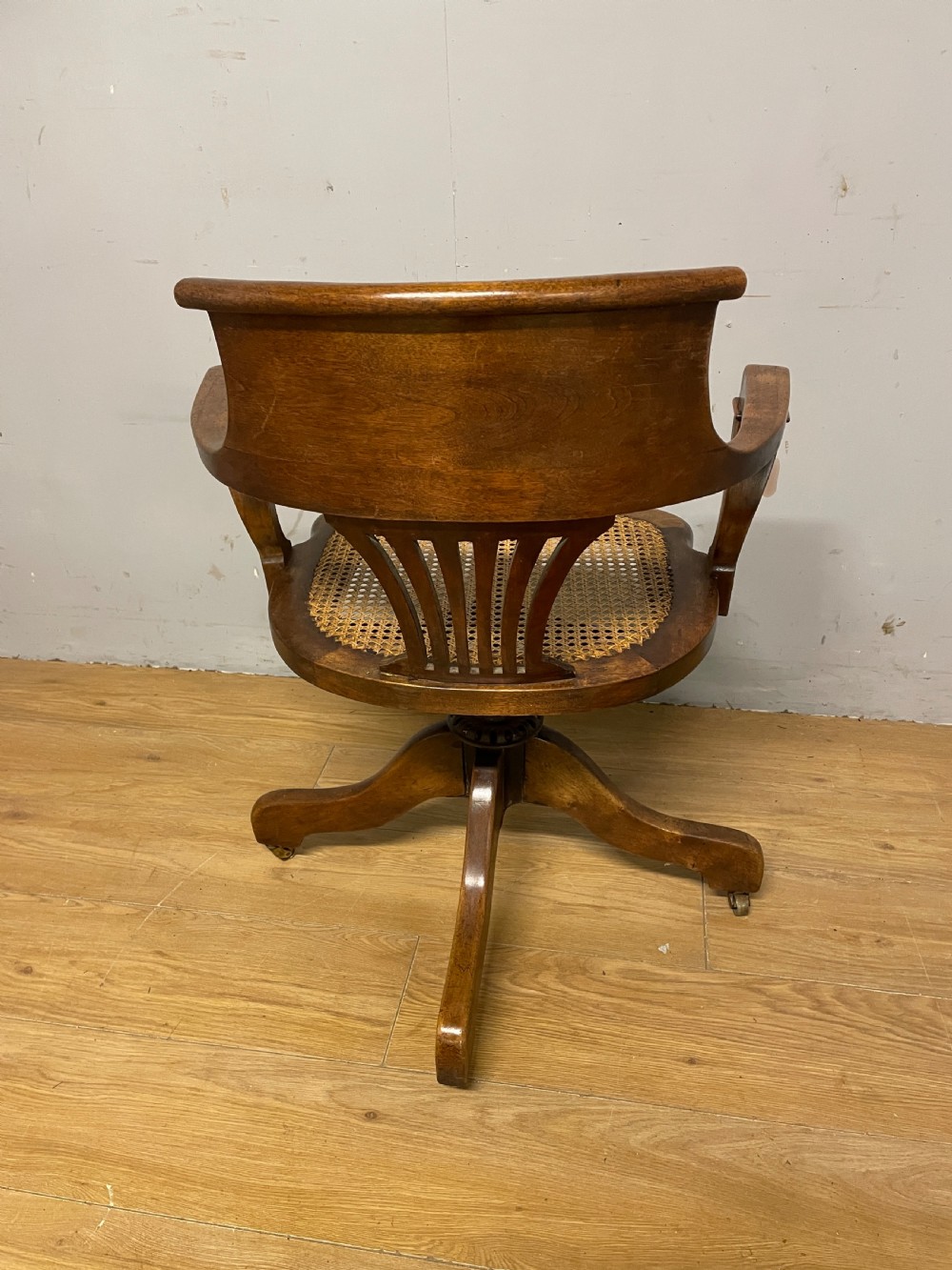 Edwardian swivel tilting office chair with a cane seat  View VIII