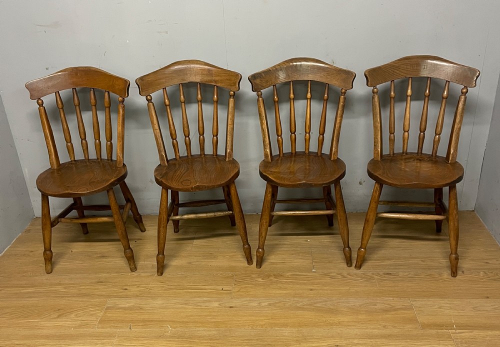 Set of four C19th elm seated kitchen chairs  View II