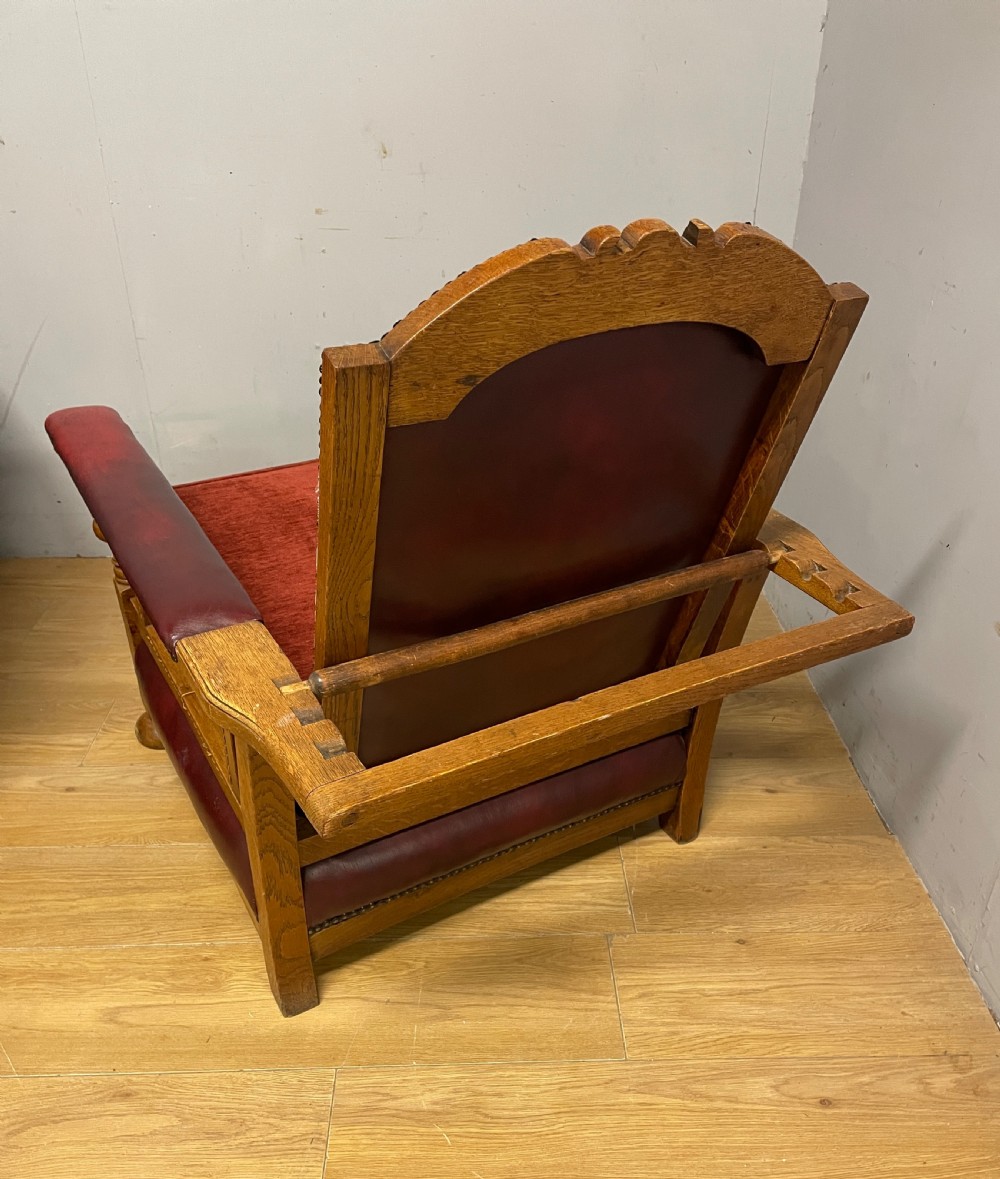 Pair of Arts and Crafts golden oak reclining leather library chairs  View II