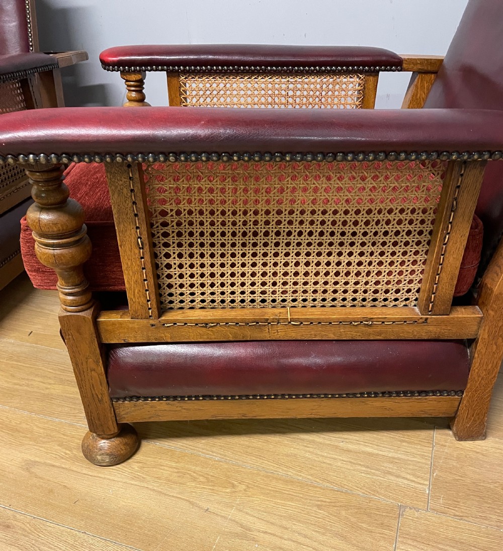 Pair of Arts and Crafts golden oak reclining leather library chairs  View III