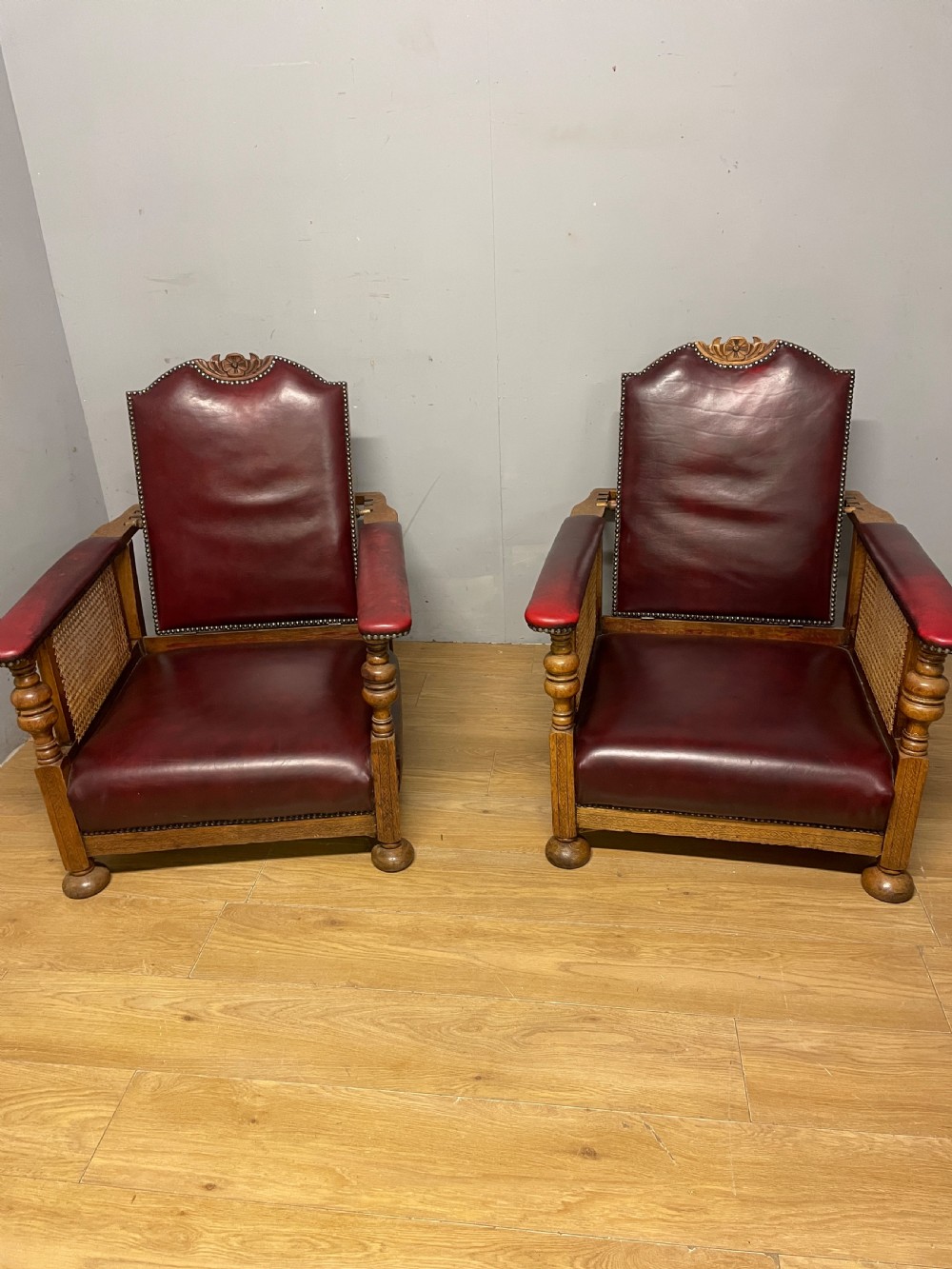 Pair of Arts and Crafts golden oak reclining leather library chairs  View VIII
