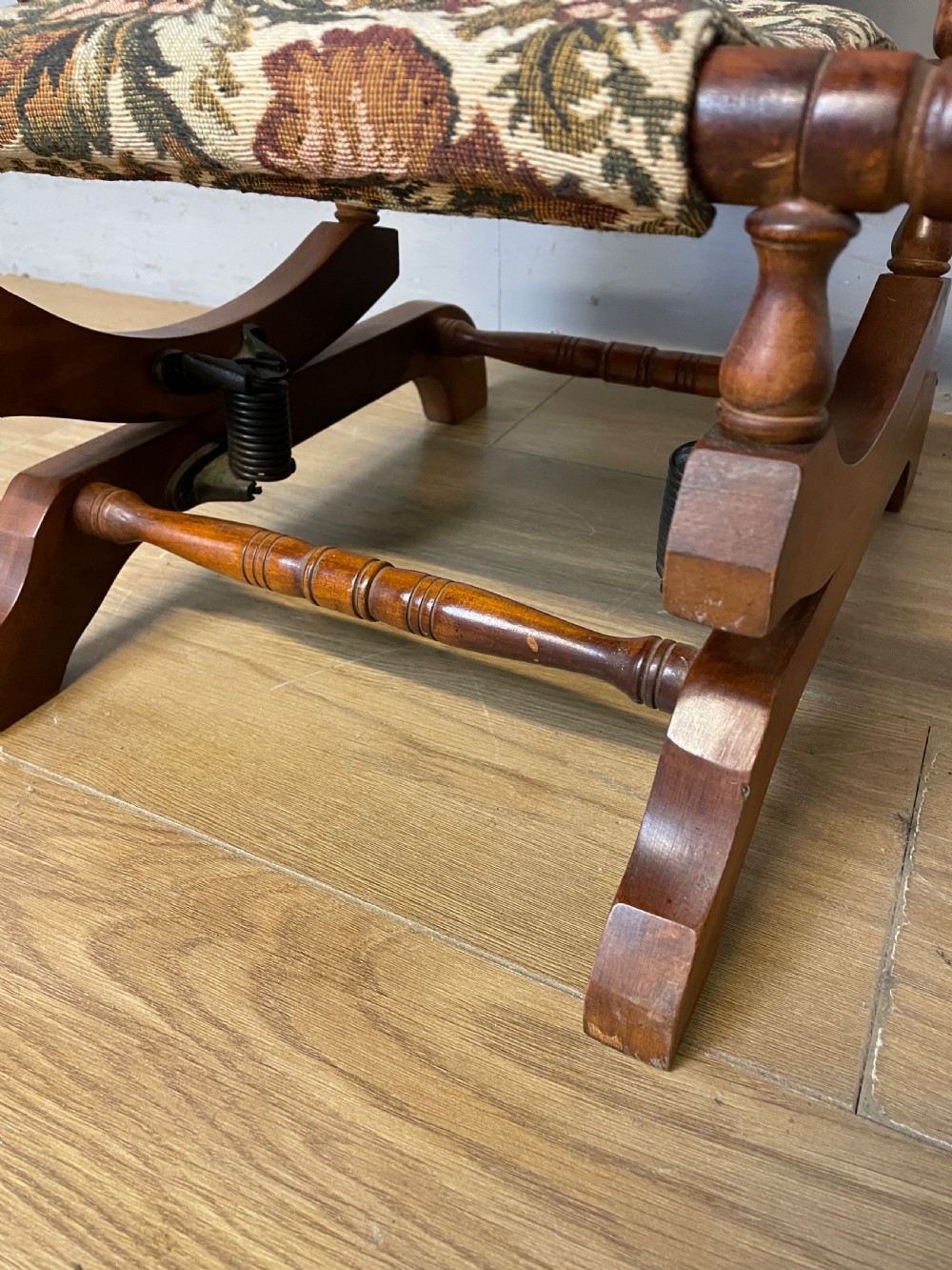 A 19th-century childs American platform rocking chair made of turned wood with floral tapestry fabric on the seat and backrest. View VIII