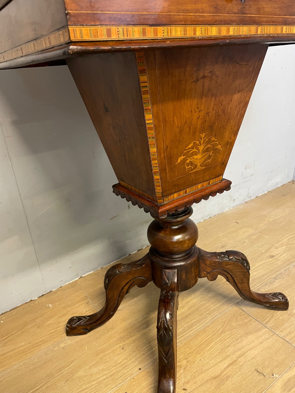 A 19th-century Victorian walnut sewing and games table featuring an inlaid chessboard top, a tapered central storage well, and a carved pedestal base. View IV