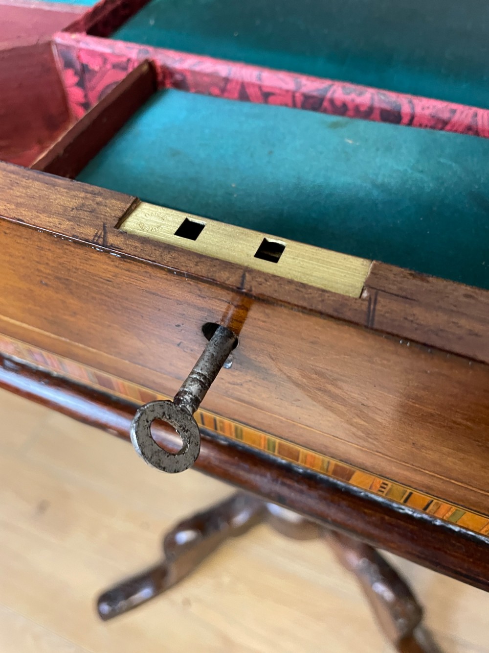 A 19th-century Victorian walnut sewing and games table featuring an inlaid chessboard top, a tapered central storage well, and a carved pedestal base. View VIII