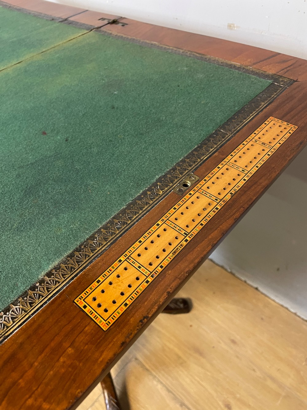 A 19th-century Victorian walnut sewing and games table featuring an inlaid chessboard top, a tapered central storage well, and a carved pedestal base. View X
