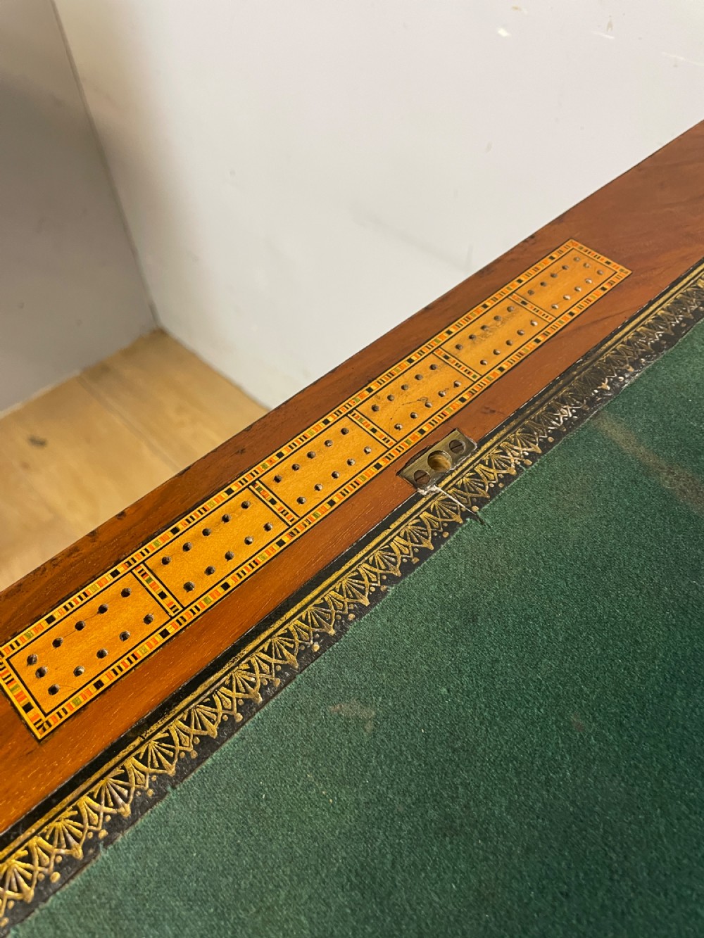 A 19th-century Victorian walnut sewing and games table featuring an inlaid chessboard top, a tapered central storage well, and a carved pedestal base. View XI