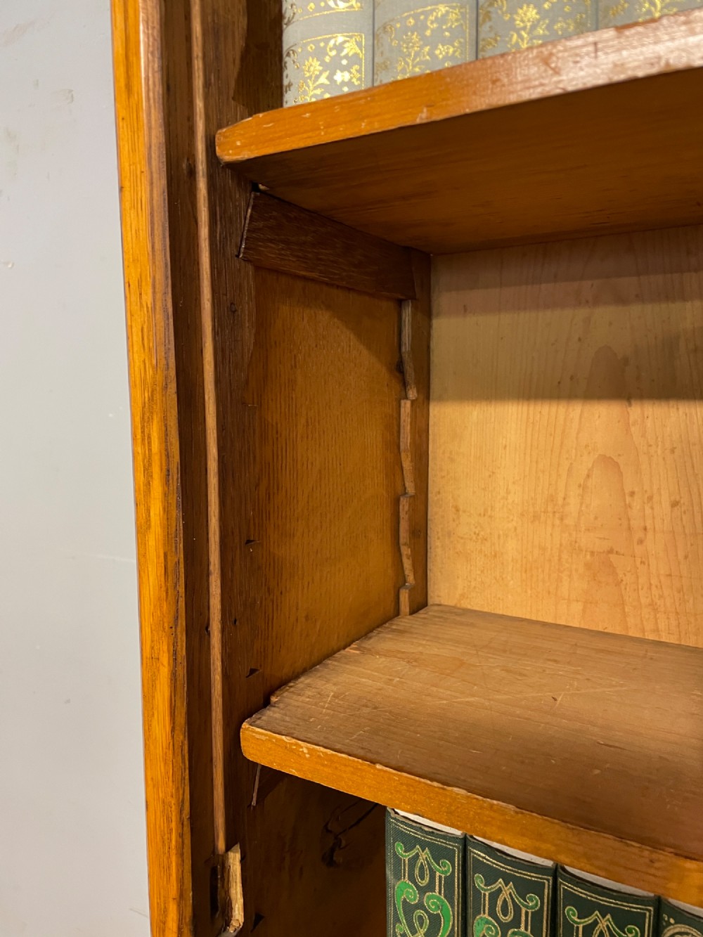 Arts and Crafts golden oak slim bookcase over cupboard View VI