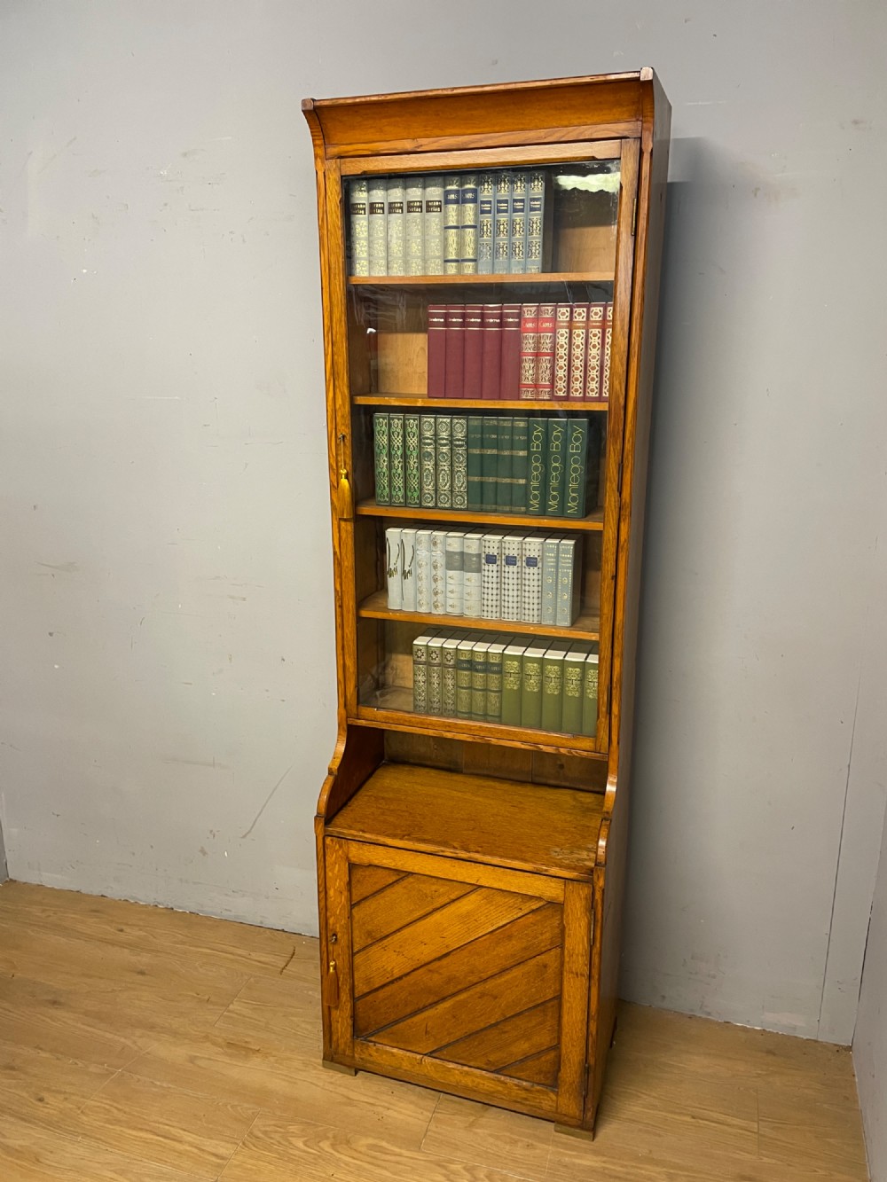 Arts and Crafts golden oak slim bookcase over cupboard View XI