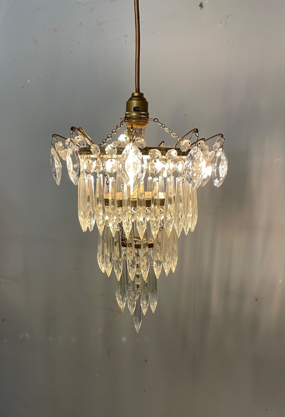 Cut glass three tier waterfall chandelier circa 1930 View V