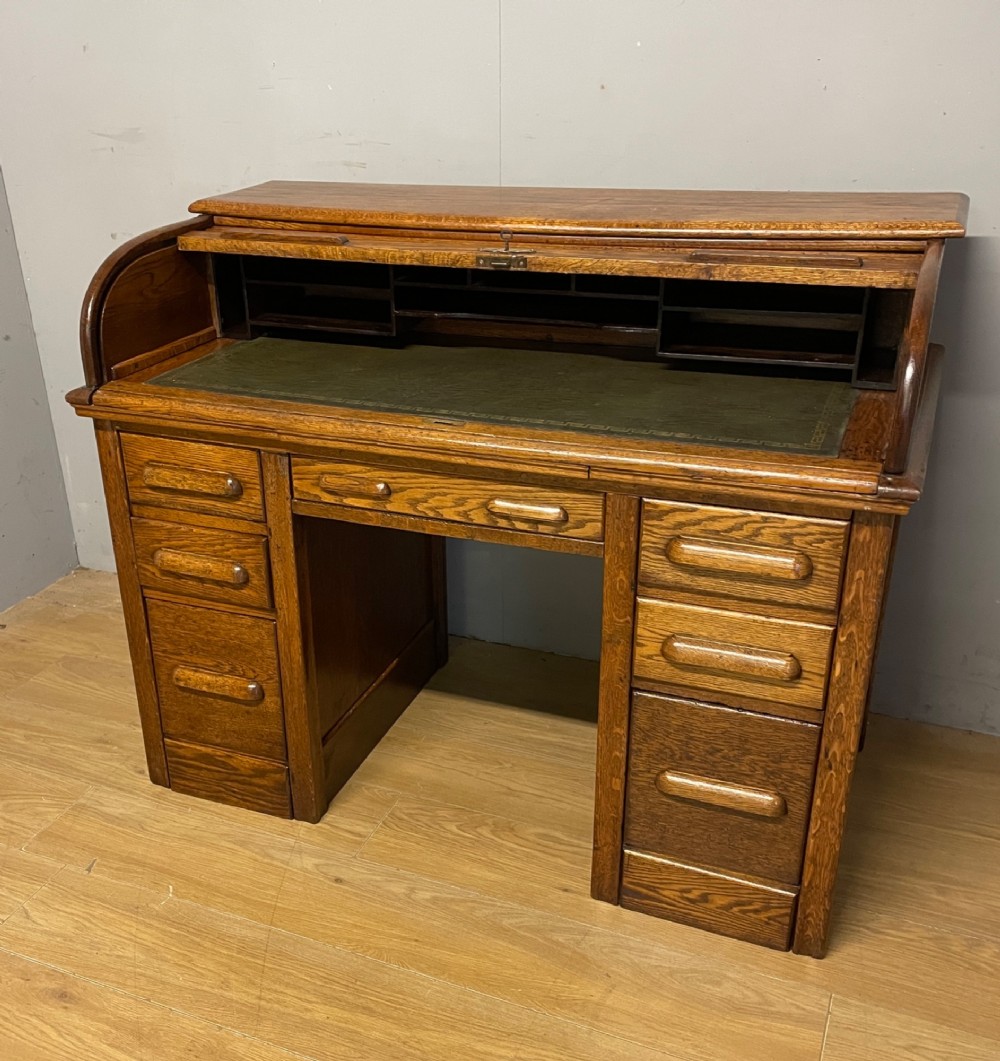 Edwardian golden oak roll top desk with tooled leather insert