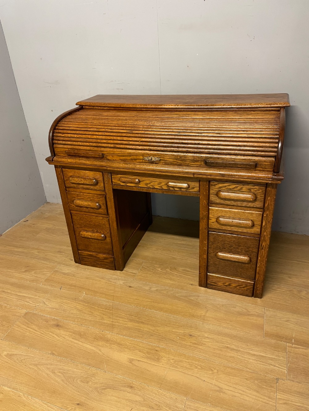 Edwardian golden oak roll top desk with tooled leather insert View II