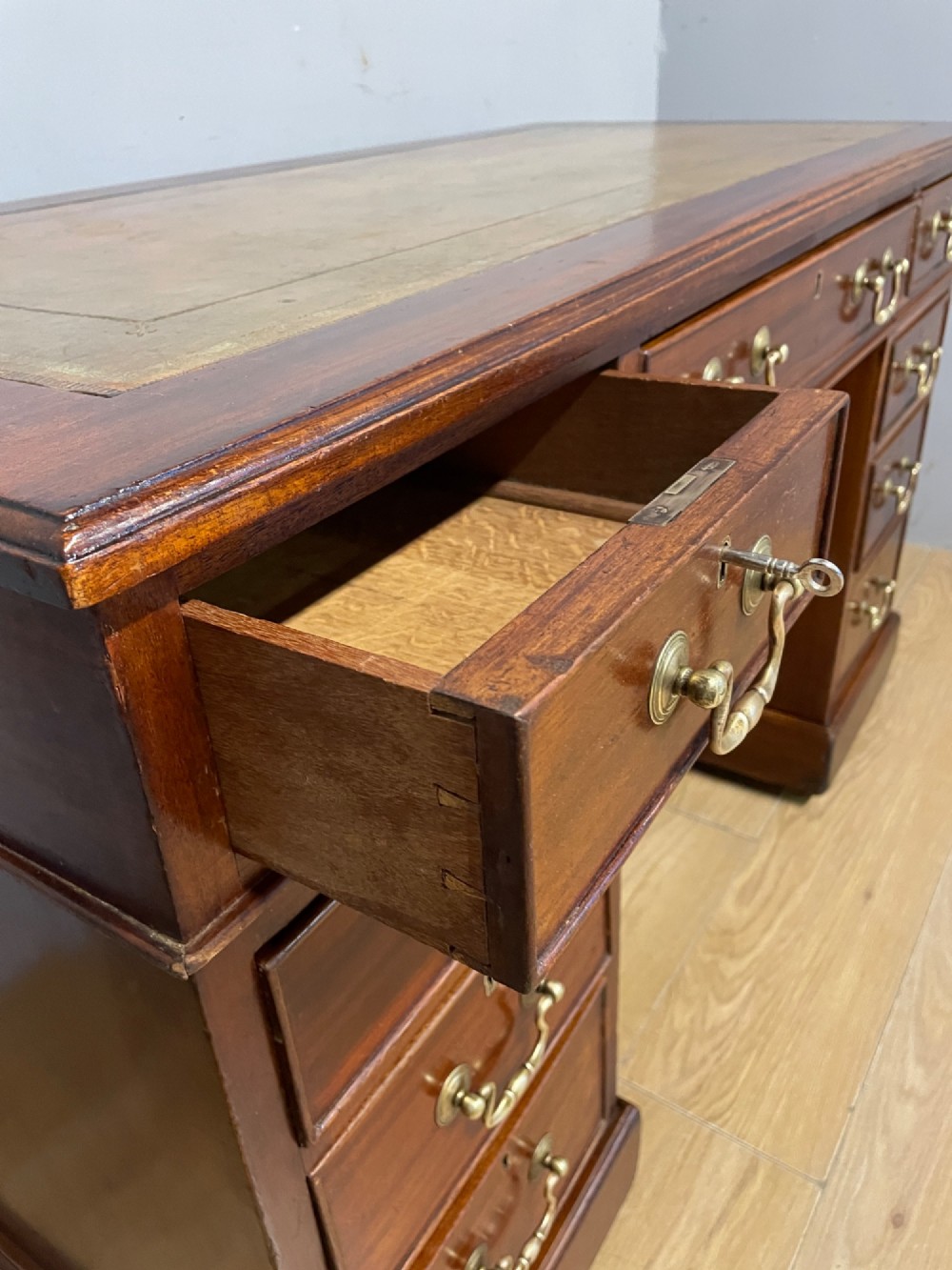 Edwardian mahogany pedestal three part desk with a tooled leather View VI