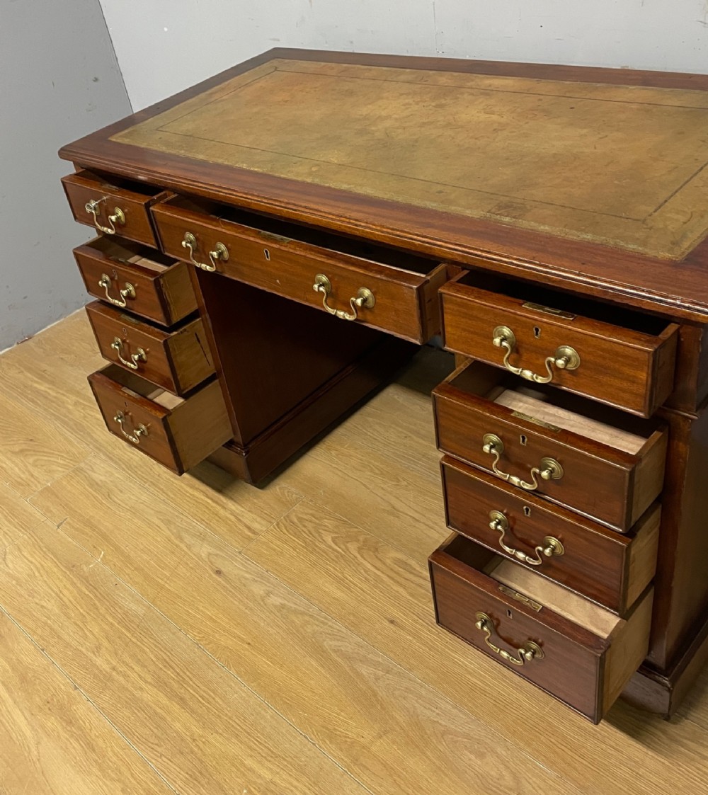 Edwardian mahogany pedestal three part desk with a tooled leather View VII