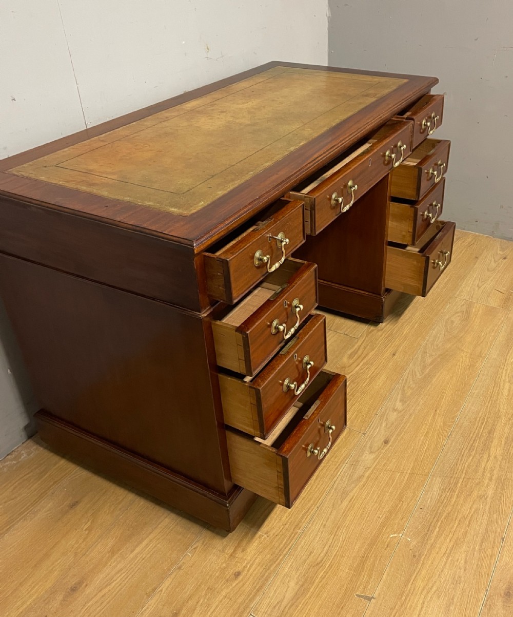 Edwardian mahogany pedestal three part desk with a tooled leather View VIII