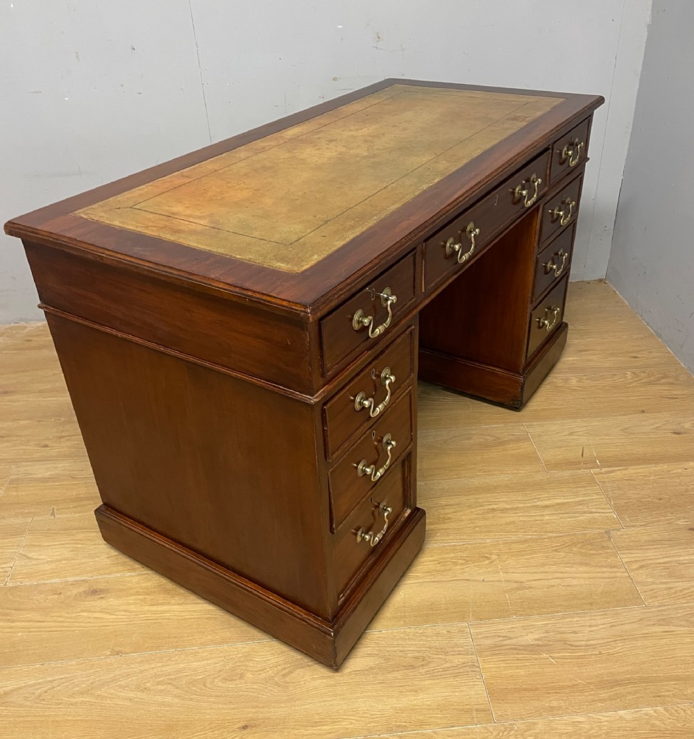 Edwardian mahogany pedestal three part desk with a tooled leather View IX