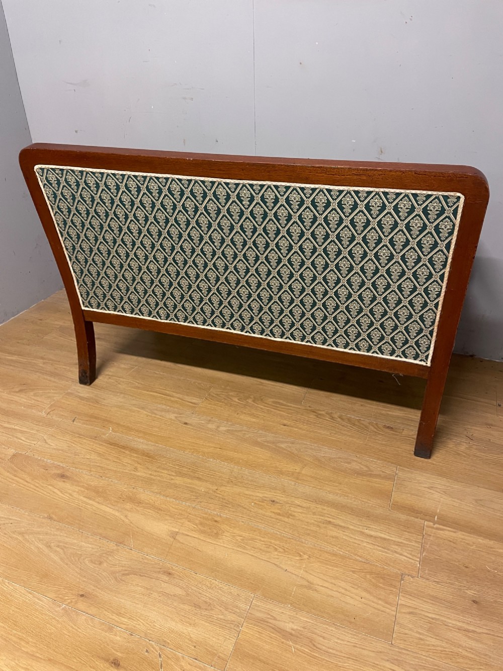 Late nineteenth-century mahogany frame two-seater sofa with deep buttoned green and cream patterned fabric upholstery. View VII