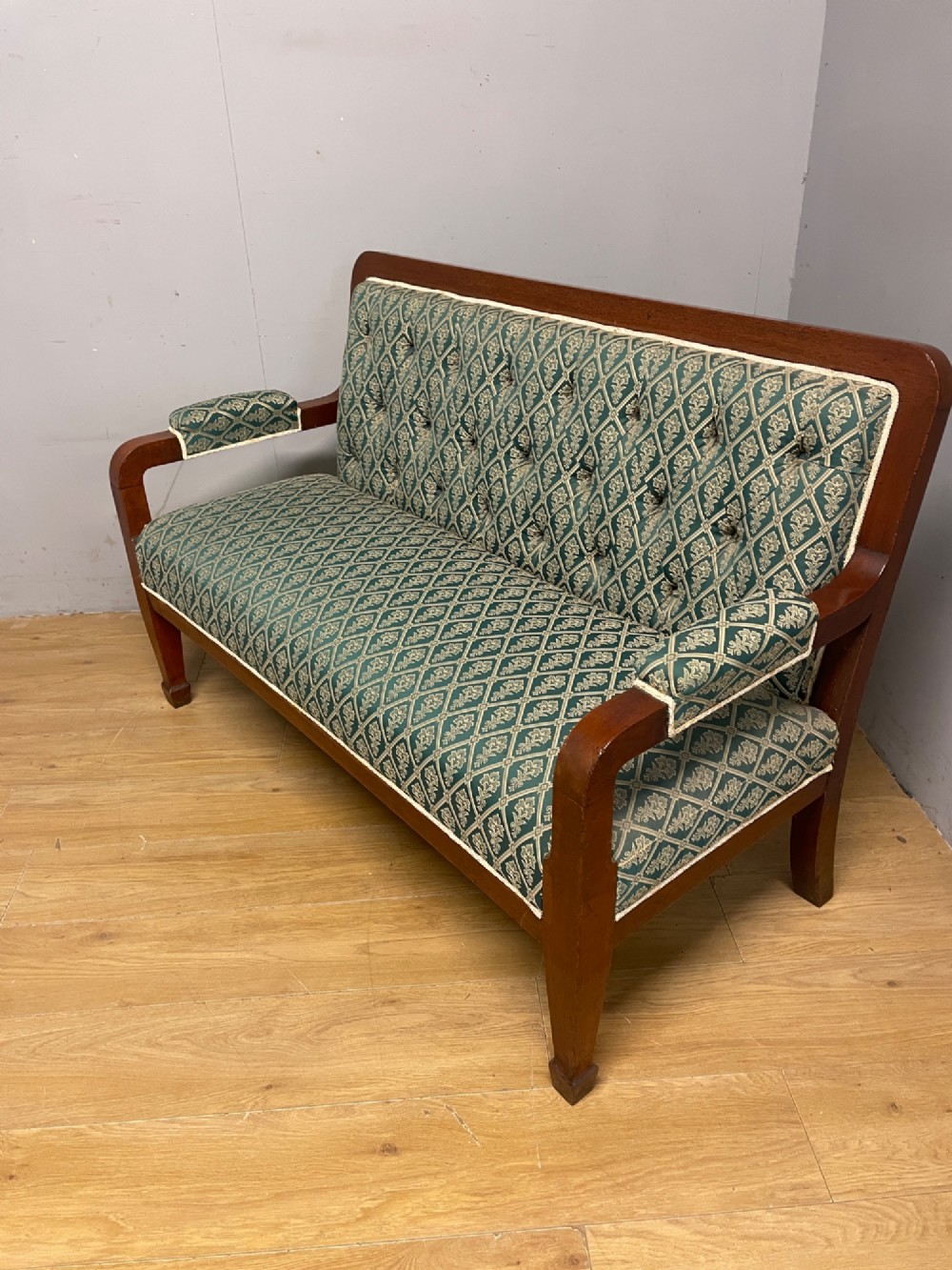 Late nineteenth-century mahogany frame two-seater sofa with deep buttoned green and cream patterned fabric upholstery. View VIII