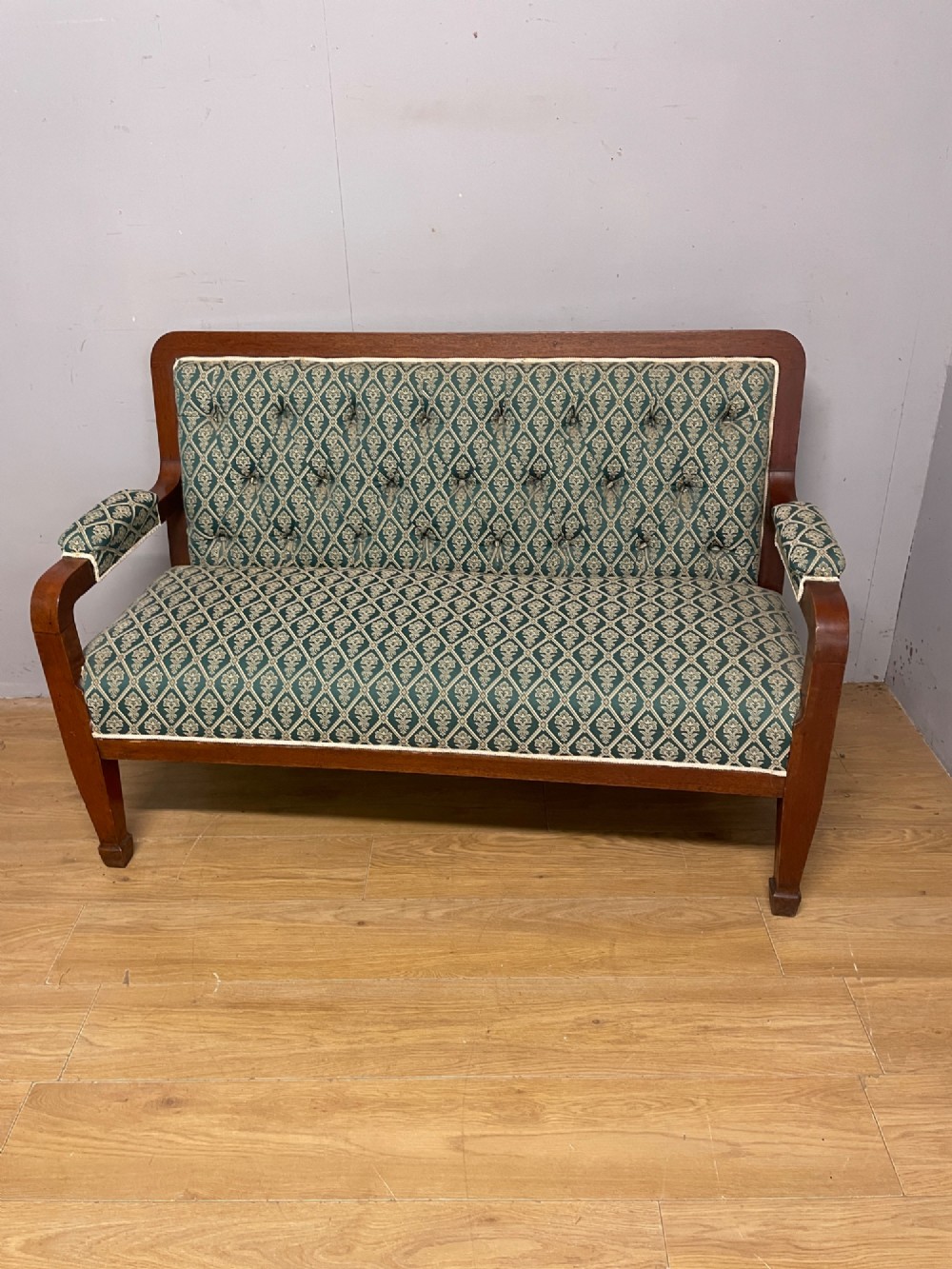 Late nineteenth-century mahogany frame two-seater sofa with deep buttoned green and cream patterned fabric upholstery. View X