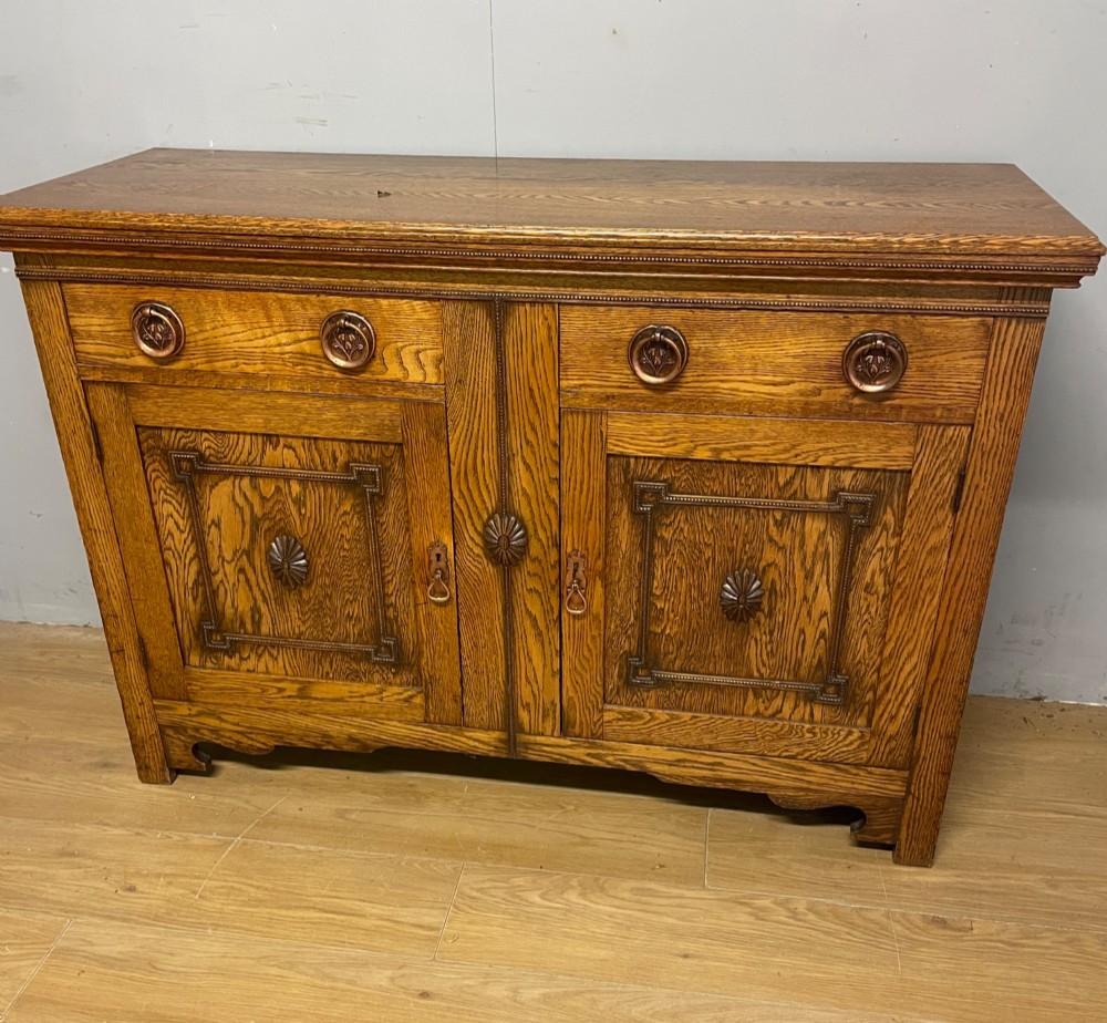 Arts and Crafts golden oak two door sideboard